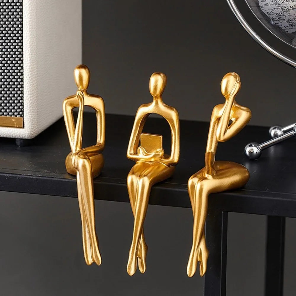 Golden Thinking Person Statue