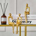 Golden Thinking Person Statue